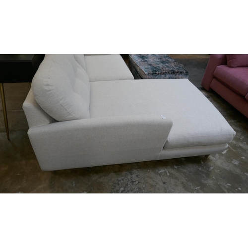 1442 - An oatmeal upholstered L shaped sofa