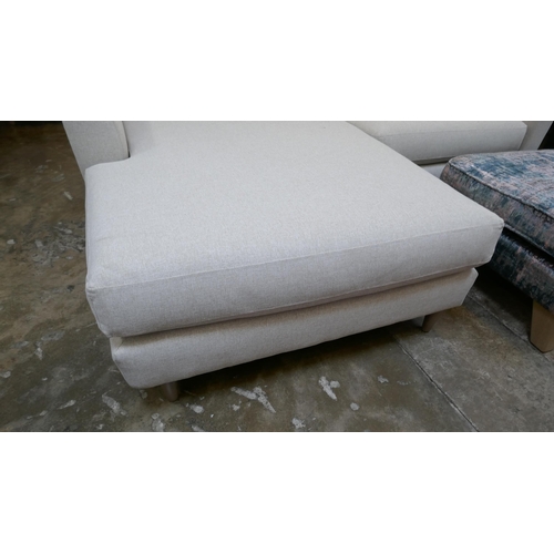 1442 - An oatmeal upholstered L shaped sofa