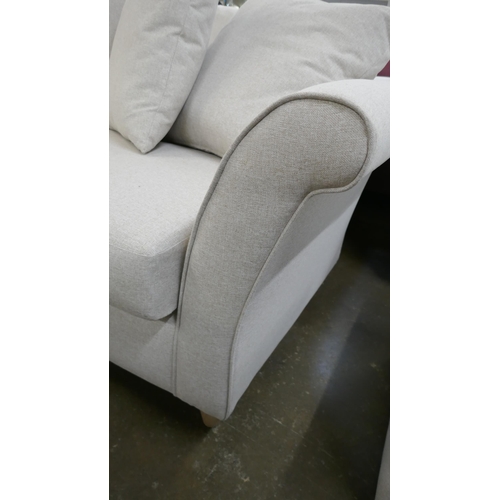 1445 - An oatmeal upholstered three seater sofa, two seater sofa, armchair and footstool