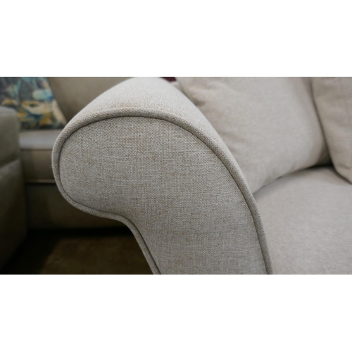 1445 - An oatmeal upholstered three seater sofa, two seater sofa, armchair and footstool