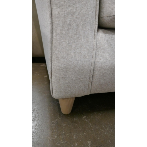 1445 - An oatmeal upholstered three seater sofa, two seater sofa, armchair and footstool