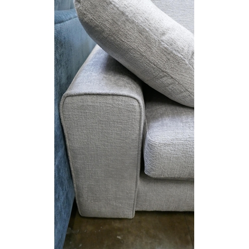 1462 - A pewter velvet three seater sofa