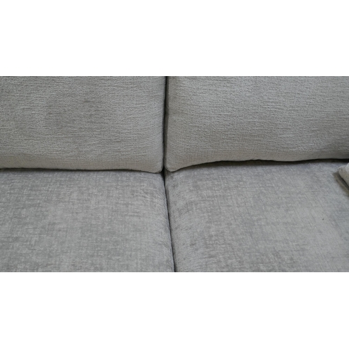 1462 - A pewter velvet three seater sofa