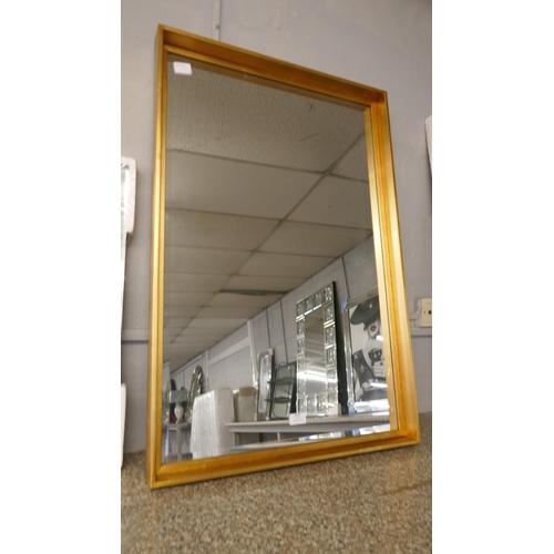 1483 - A bevelled gold framed mirror