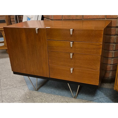 23 - A Stag S-Range teak sideboard, on chrome hairpin legs, designed by John & Sylvia Reid