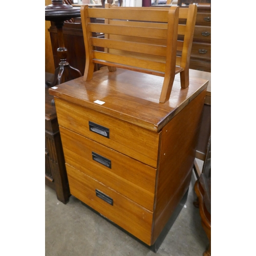 90 - A teak chest of drawers and a magazine rack