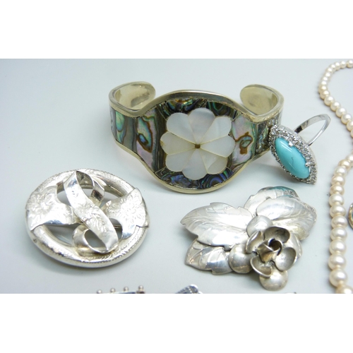 1073 - A hallmarked Victorian silver brooch, Birmingham 1890, three other brooches, a 925 silver ring with ... 