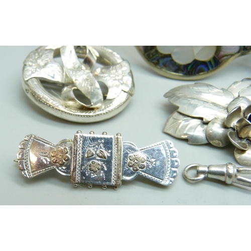 1073 - A hallmarked Victorian silver brooch, Birmingham 1890, three other brooches, a 925 silver ring with ... 