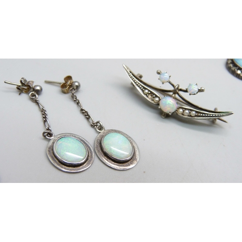 1086 - A opal set silver brooch, a pair of opal and silver drop earrings and a silver, marcasite and opal n... 