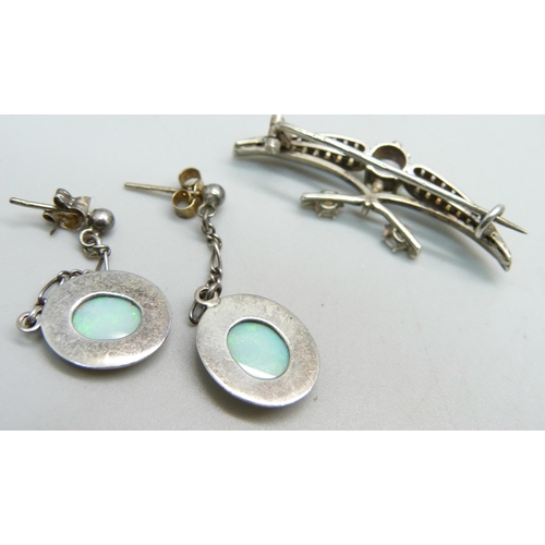 1086 - A opal set silver brooch, a pair of opal and silver drop earrings and a silver, marcasite and opal n... 