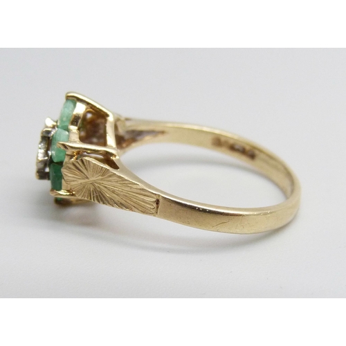 1099 - A 9ct gold, diamond and emerald ring, 2.4g, O