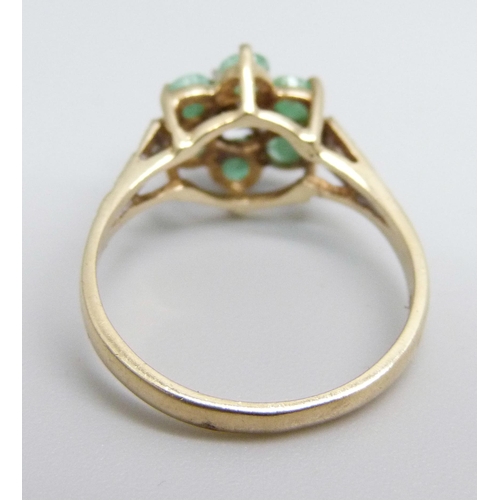 1099 - A 9ct gold, diamond and emerald ring, 2.4g, O