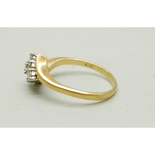 1116 - An 18ct gold and nine diamond ring, 5.3g, S/T