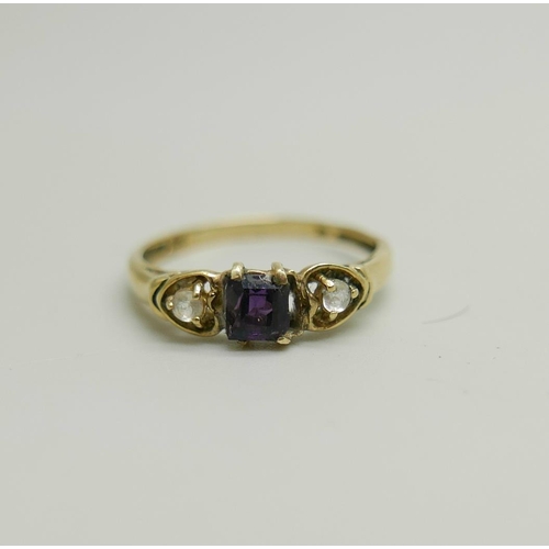 1169 - A 9ct gold, amethyst and white stone ring, 1.1g, M