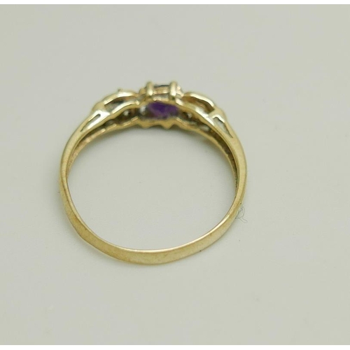 1169 - A 9ct gold, amethyst and white stone ring, 1.1g, M