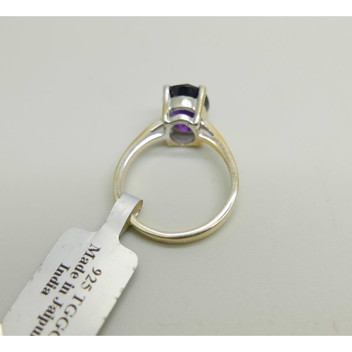 1170 - A silver gilt and amethyst solitaire ring, N