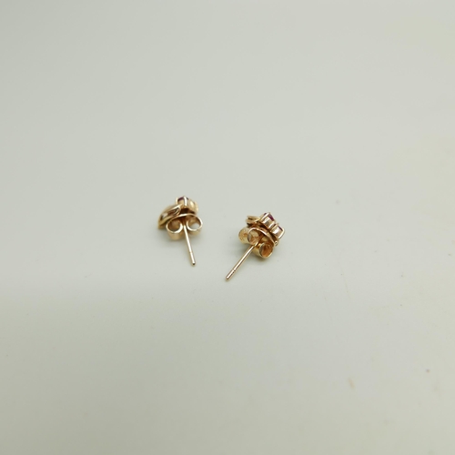 1177 - A pair of 14k gold and ruby earrings, 1.5g