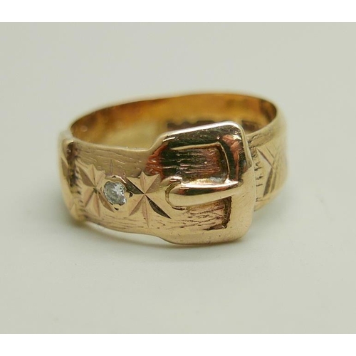 1181 - A 9ct gold and diamond buckle ring, 4.8g, N, shank a/f