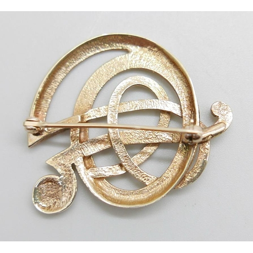 1187 - A 9ct gold Arts and Crafts Ola Gorie brooch, 7.3g, 34mm wide