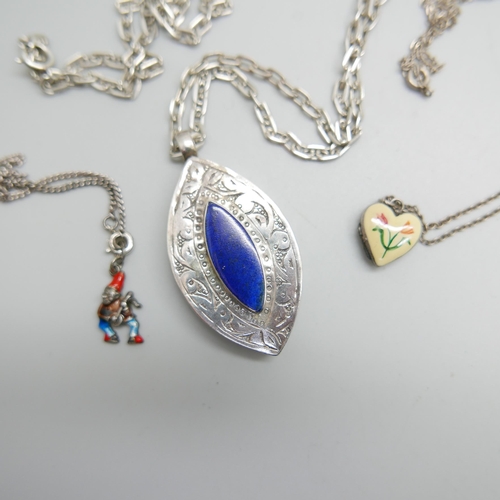 1192 - A silver pendant, a silver and enamelled locket and a silver bracelet with enamelled charm