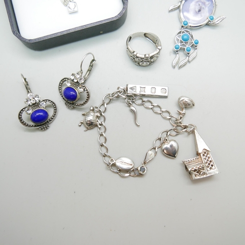 1212 - Silver jewellery; a pendant and chain x2, earrings, ring and charm bracelet