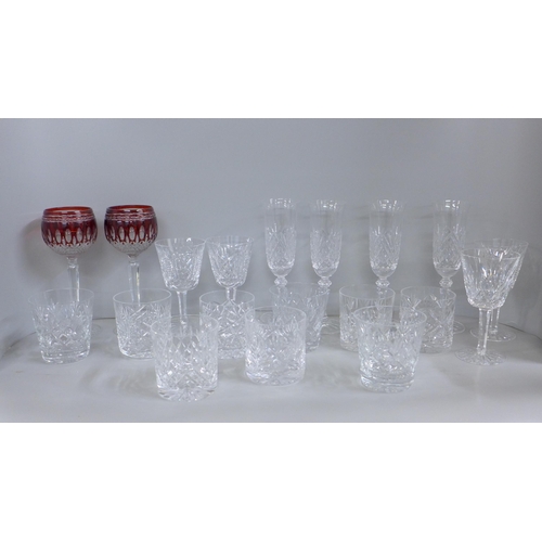 1217 - A collection of lead crystal glass including four Galway champagne flutes, four Waterford Crystal wi... 