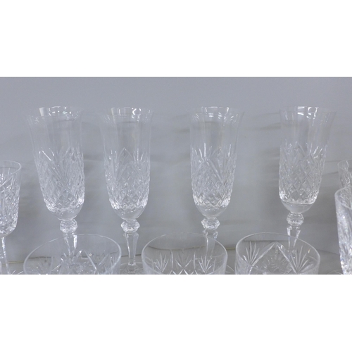 1217 - A collection of lead crystal glass including four Galway champagne flutes, four Waterford Crystal wi... 