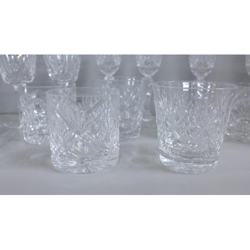 1217 - A collection of lead crystal glass including four Galway champagne flutes, four Waterford Crystal wi... 