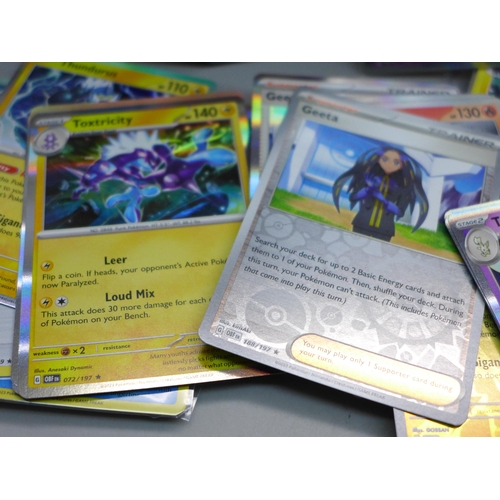 622 - Over 700 Pokemon cards in tins, with holos (two tins)