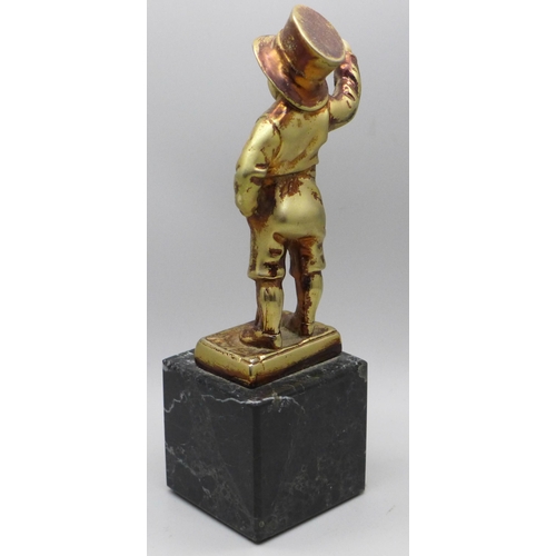 636 - An Art Deco style gilt metal figure of a street urchin, after Mehnert on a marble base, 17cm