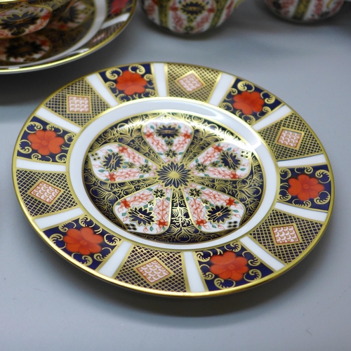 637 - A collection of Royal Crown Derby 1128 pattern Imari; two tea plates, three large saucers, two soup ... 