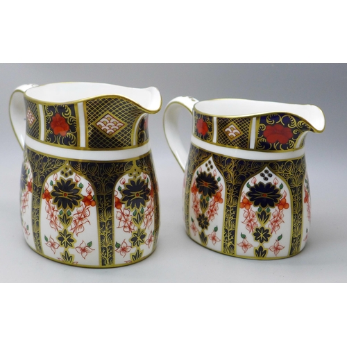 638 - A Royal Crown Derby 1128 Imari pattern cream jug and sugar (x2), smaller milk jug second