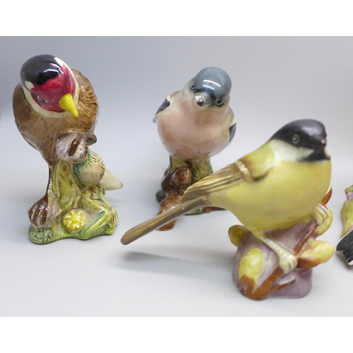 645 - A collection of eight Beswick and Royal Worcester models of birds