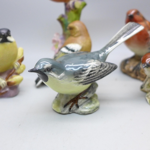 645 - A collection of eight Beswick and Royal Worcester models of birds