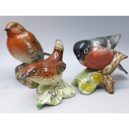 645 - A collection of eight Beswick and Royal Worcester models of birds