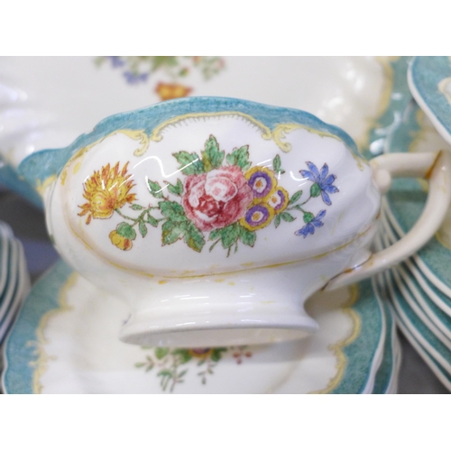 667 - Royal Doulton Kingswood D3601 part dinner service with two tureens and two graduated serving plates,... 