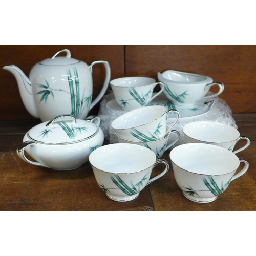 673 - A Tokai China (Japan) tea set, six plates and saucers with tea pot