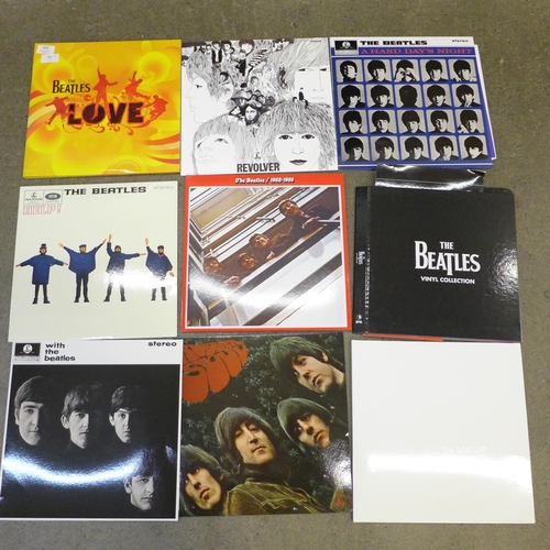 674 - Twelve The Beatles LP records, re-issues, in VG condition, (Revolver x2 and Love album) folder and e... 