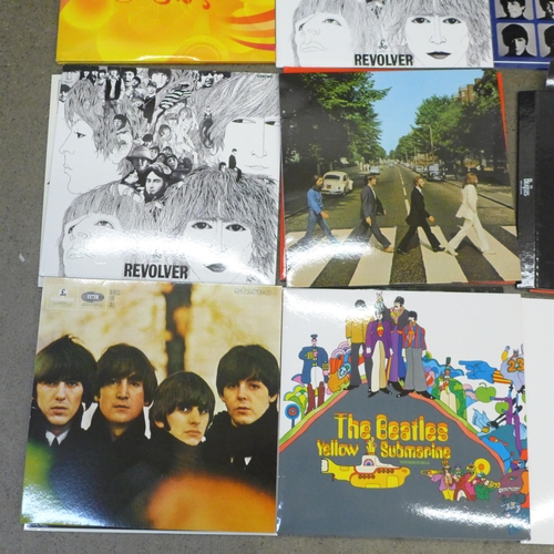 674 - Twelve The Beatles LP records, re-issues, in VG condition, (Revolver x2 and Love album) folder and e... 