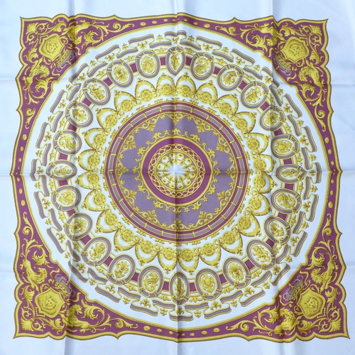 675 - A collection of four lady's silk scarves including two Singapore Batik, packaged