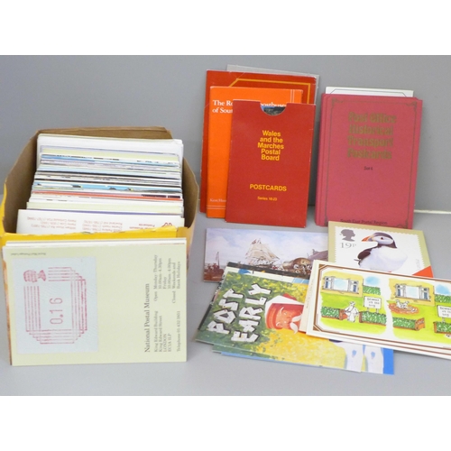 678 - Postcards; a box of philately related postcards