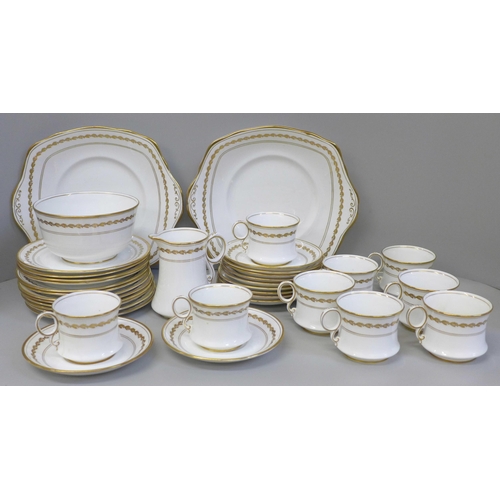 681 - A Royal Albert 5430 tea service comprising two cake plates, twelve tea plates, eleven saucers, nine ... 