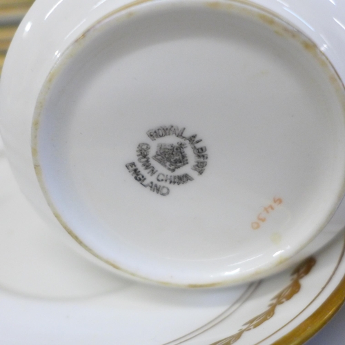 681 - A Royal Albert 5430 tea service comprising two cake plates, twelve tea plates, eleven saucers, nine ... 