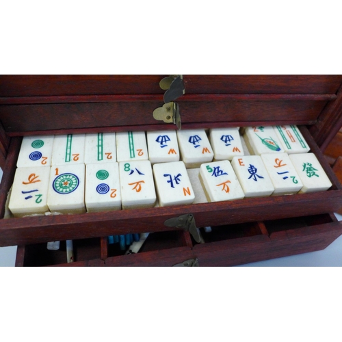 684 - A Mahjong set in original wooden box, bone and bamboo pieces with documents from the Sungei Ljong Cl... 