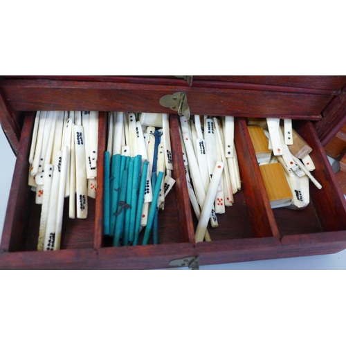 684 - A Mahjong set in original wooden box, bone and bamboo pieces with documents from the Sungei Ljong Cl... 