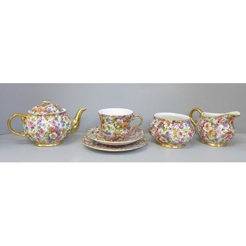 688 - A James Kent chintz teaset for one, a Du Barry pattern chintz teapot, cream jug, sugar bowl, side pl... 