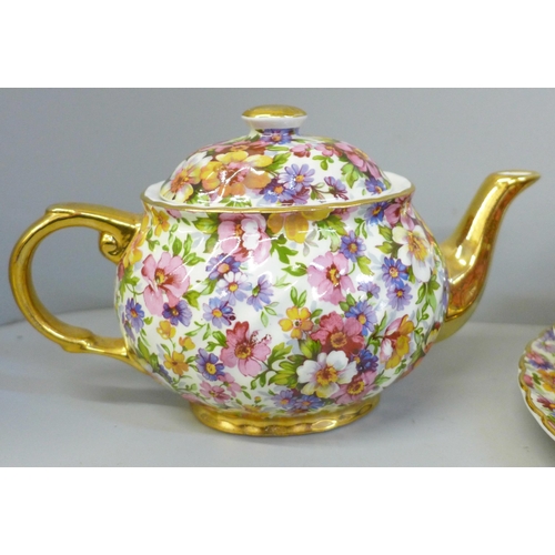 688 - A James Kent chintz teaset for one, a Du Barry pattern chintz teapot, cream jug, sugar bowl, side pl... 