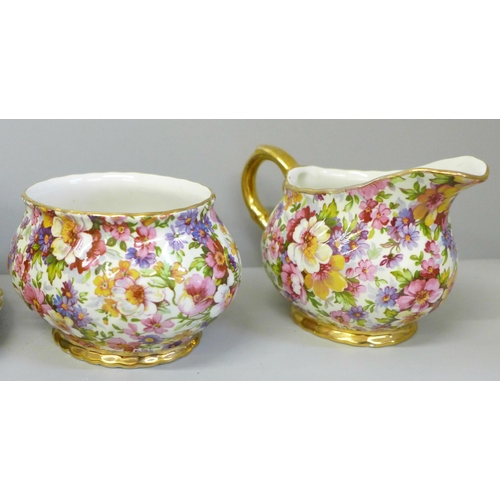 688 - A James Kent chintz teaset for one, a Du Barry pattern chintz teapot, cream jug, sugar bowl, side pl... 