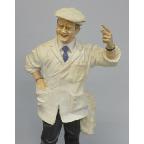 692 - A Royal Doulton figure of Harold 'Dickie' Bird, MBE on stand