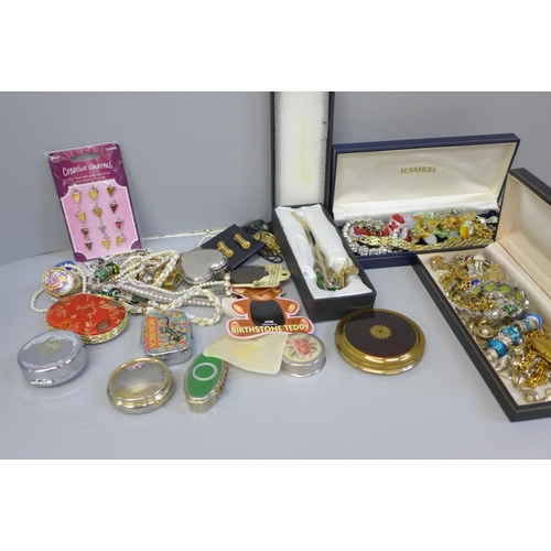 703 - A collection of lady's pill boxes, a powder case, decorative bookmarks, a jade elephant, costume jew... 